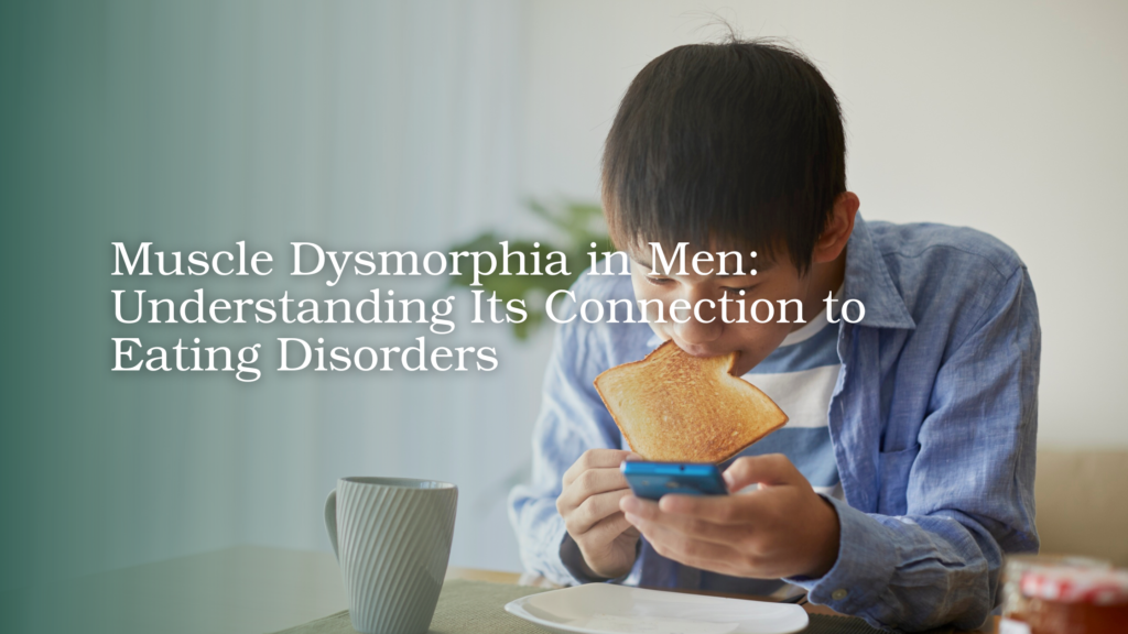 Young man experiencing body image concerns while eating and looking at his phone