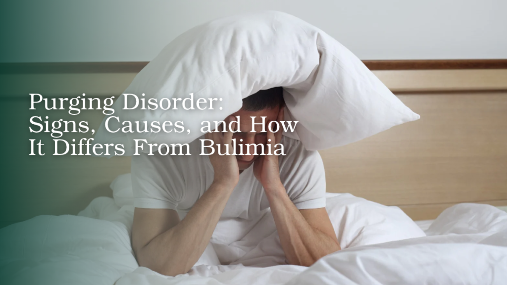 Person experiencing emotional distress while sitting on a bed